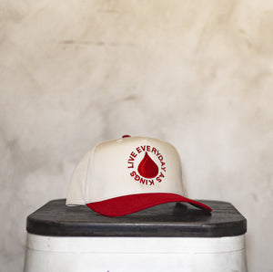 RED TRADEMARK SNAPBACK